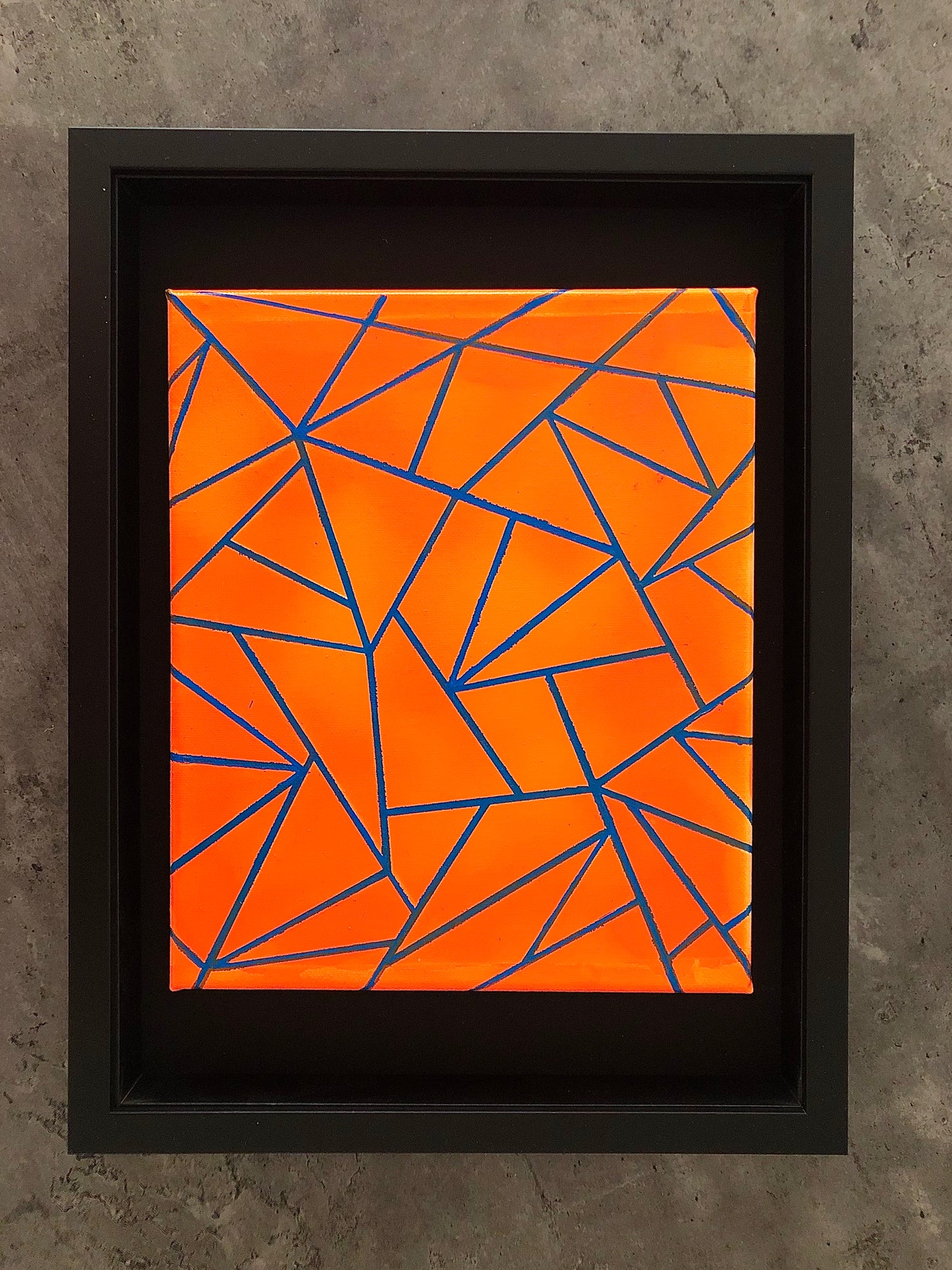 Neon orange triangles geometric modern acrylic painting in black wooden box frame